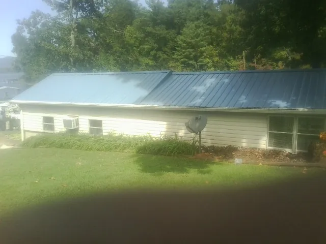 Blue metal roof running the length of a single story home in Niles